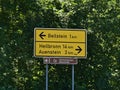 Sign with distances to Auenstein and city Heilbronn at junction of road, part of WÃÂ¼rttemberger WeinstraÃÅ¸e, near Beilstein. Royalty Free Stock Photo